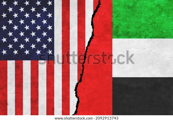 USA and UAE painted flags on a wall\
with a crack. USA and UAE relations. United Arab Emirates and\
United States of America flags together. USA vs\
UAE