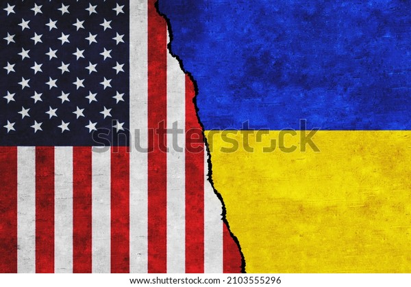 USA and Ukraine painted flags on a wall with a\
crack. Ukraine and United States of America relations. USA and\
Ukraine flags\
together