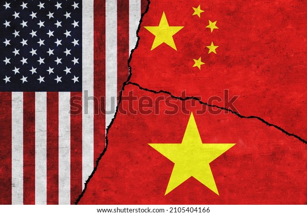 USA,\
Vietnam and China painted flags on a wall with a crack. United\
States of America, China and Vietnam\
conflict
