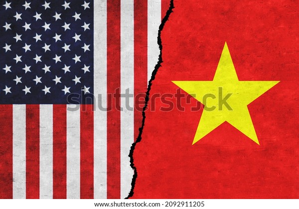 USA and Vietnam painted flags on a wall with a\
crack. USA and Vietnam conflict. Vietnam and United States of\
America flags together. USA vs\
Vietnam