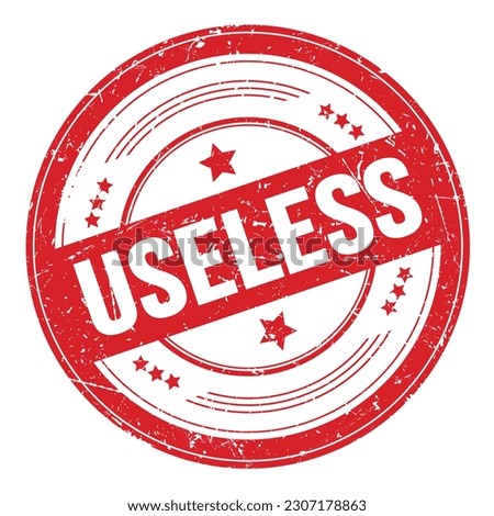 USELESS text on red round grungy texture stamp.