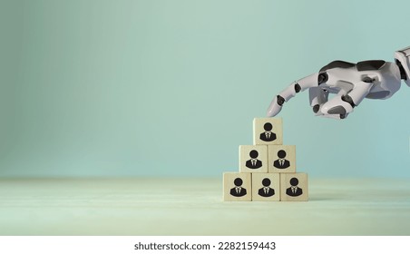 Using AI for recruiting concept. 3d rendering robot hand put ,pick or choose the one who got idea or special or right man for job than other in human resources management (hrm) or recruitment concept.
