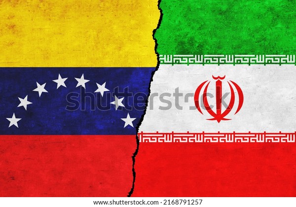 Venezuela\
and Iran painted flags on a wall with a crack. Venezuela and Iran\
relations. Iran and Venezuela flags\
together