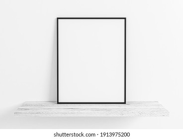 Vertical Black Frame Mockup. Black Frame Posters On Clean White Wall And White Wooden Shelf. 3D Illustration