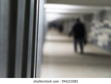Vertical left aligned wall with man walking on the left background