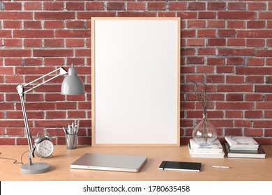 Vertical Poster Frame Mockup On The Wooden Table Of Home Studio Workspace With Red Brick Wall. Side View, Clipping Path Around Poster Picture. 3d Illustration