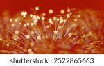 A vibrant abstract background in fiery red with dazzling golden sparks and a mesmerizing bokeh effect.