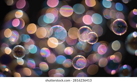 A vibrant abstract composition featuring colorful soap bubbles and soft glowing bokeh lights against a dark background.