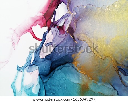 Vibrant abstract fluid art painting background alcohol ink technique. Maroon and blue colors with glowing gold powder. Mixture of paints. Romantic design.