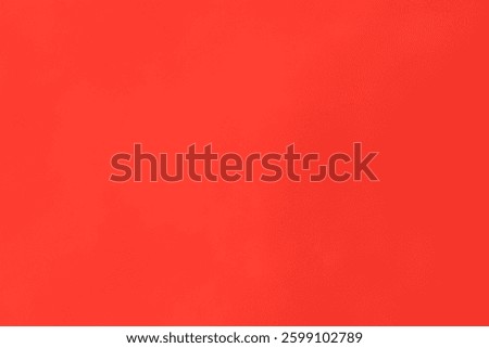 Vibrant solid color coral backdrop for graphic design and artistic composition creation with minimal texture and warm hue