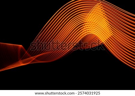 Vibrant and visually striking orange wave patterns create a stunning visual contrast against a deep black backdrop