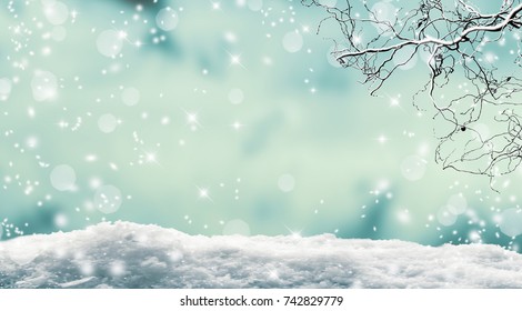 vibrant winter landscape, snow cover and snowy branch on abstract sparkling blurred background, beautiful empty winter background, idyllic winter concept with copy space for the holiday season