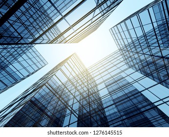 View Of High Rise Glass Building And Dark Steel Window System On Blue Clear Sky Background,Business Concept Of Future Architecture,looking Up To The Sun Light On The Top Of Building. 3d Render