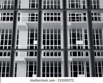 The view from the inside of a brick jail cell with iron bars.