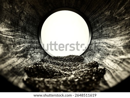 A view through the inside of a whiskey barrel looking out filled with grain - 3D render