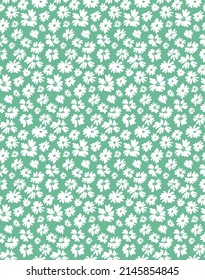 Vintage floral background. Seamless pattern for design and fashion prints. Elegant floral pattern with small white flowers on a green background. Ditsy style.
