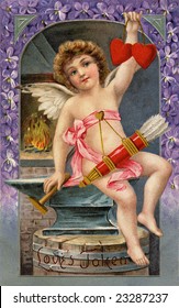 Vintage Illustration Of A Cupid Forging Two Valentine Hearts, A 1911 Victorian Greeting, 'Love's Token'