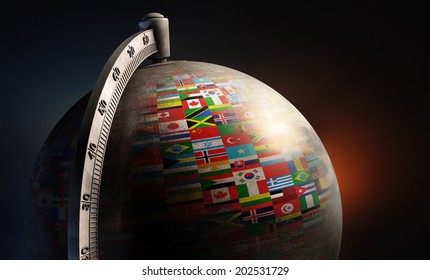 vintage metal desktop globe with nation flags on dark abstract background