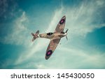 Vintage style colored artwork of a Battle of Britain era, British RAF Spitfire fighter at high altitude. This aircraft became famous during the summer of 1940 - Artist