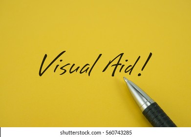 Visual Aid! Note With Pen On Yellow Background