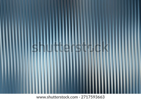 A visually pleasing abstract backdrop featuring vertical gradient lines in shades of blue and gray.