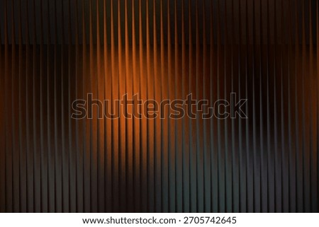 a visually striking abstract background with vertical lines and a gradient of orange and dark brown hues