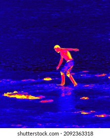 Walking On Thin Ice (buck The Odds). Thermal Impressionism. Unrecognizable Person. Kinetics Of Body Corresponds To Desire Of Person To Exert Minimum Load On Surface