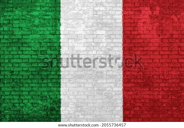 wall of\
bricks painted with the flag of Italy, green white and red colors.\
3D background. Concept of social barriers of immigration,\
divisions, and political conflicts in\
Italy.