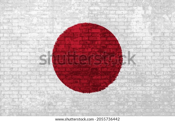 wall of bricks painted\
with the flag of Japan, red white colors. 3D background. Concept of\
social barriers of immigration, divisions, and political conflicts\
in Japan.