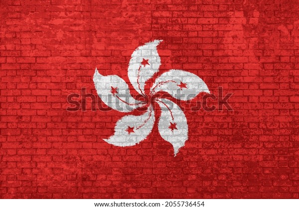 wall of bricks painted with the National flag of\
Hong Kong in China isolated. 3D illustration. Concept of social\
barriers of immigration, divisions, and political conflicts in Hong\
Kong.