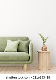 Wall Mockup In Living Room Interior With Green Velvet Couch, Pillows And Leaves In Wooden Vase Standing On Slat Side Table. Illustration, 3d Rendering