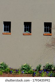 A wall with three windows