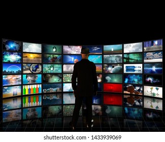 Wall Of Tv Screens With A Viewer. Digital Art Gallery. 3D Rendering