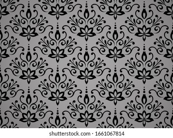 Wallpaper in the style of Baroque. Seamless background. Black and grey floral ornament. Graphic pattern for fabric, wallpaper, packaging. Ornate Damask flower ornament