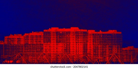 It's warm around the house. Illustration of heat loss in an apartment building in winter (external heat losses ). Thermal pollution. Infrared image