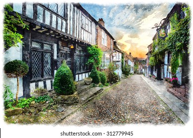 Water colour painting of beautiful tudor style half timbered houses lining a cobbled street in Rye, Sussex