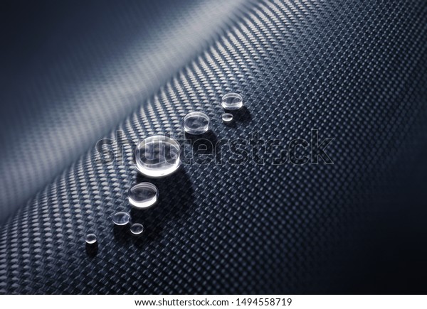 Water\
drops on carbon fabric surface - 3D\
illustration