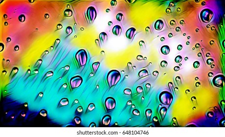 Water drops with rainbow background.