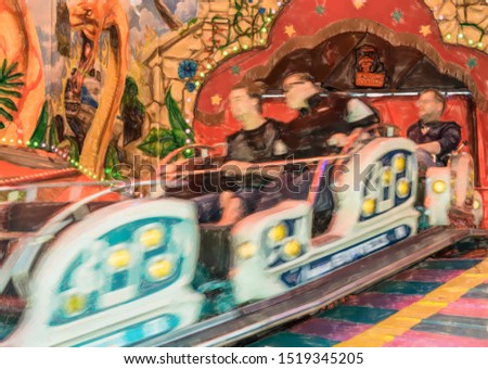 watercolor illustration: Fast carousel in motion, intended motion blur on a fairgrounf
