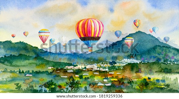 Watercolor landscape painting of hot air balloon on village