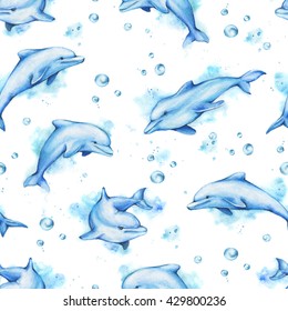 Watercolor pattern with dolphins swimming. Animals splashes of water and bubbles