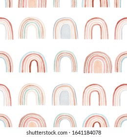 Watercolor seamless pattern with rainbows in warm pastel colors. Hand drawn cute abstract background, digital paper perfect for kids fabric textile and wrapping paper.