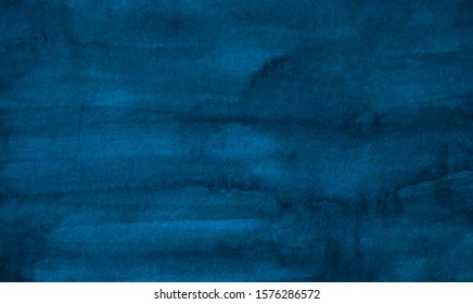 Watercolor vintage deep blue stains background texture. Aquarelle abstract brush strokes on paper.