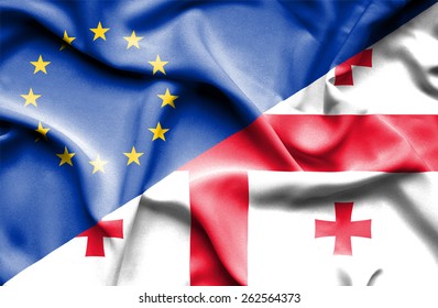 Waving flag of Georgia and European Union