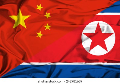 Waving Flag Of North Korea And China