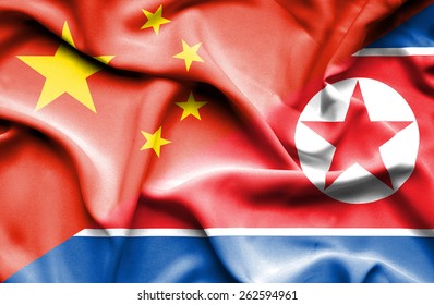 Waving Flag Of North Korea And China