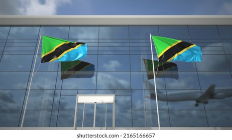 Waving Flags Of Tanzania In The Airport And Landing Airplane 3D Rendering