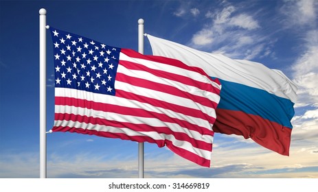 Waving Flags Of USA And Russia On Flagpole, On Blue Sky Background.