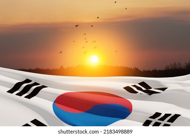 Waving South Korea flag on sunset sky with flying birds. Background with place for your text. 3d-rendering. - Powered by Shutterstock