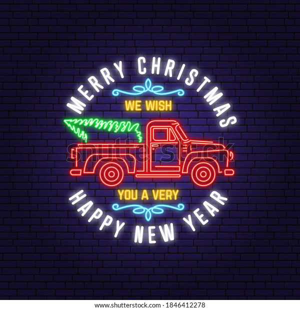 We wish you a\
very Merry Christmas and Happy New Year neon sign with classic red\
christmas ttruck. Vintage typographic design for xmas, new year\
emblem in retro style with\
pickup.
